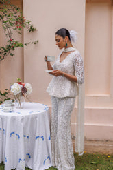 Exquisite pastel ivory peplum with floral detailing and sparkling beadwork from our bridal and bridesmaid collection.