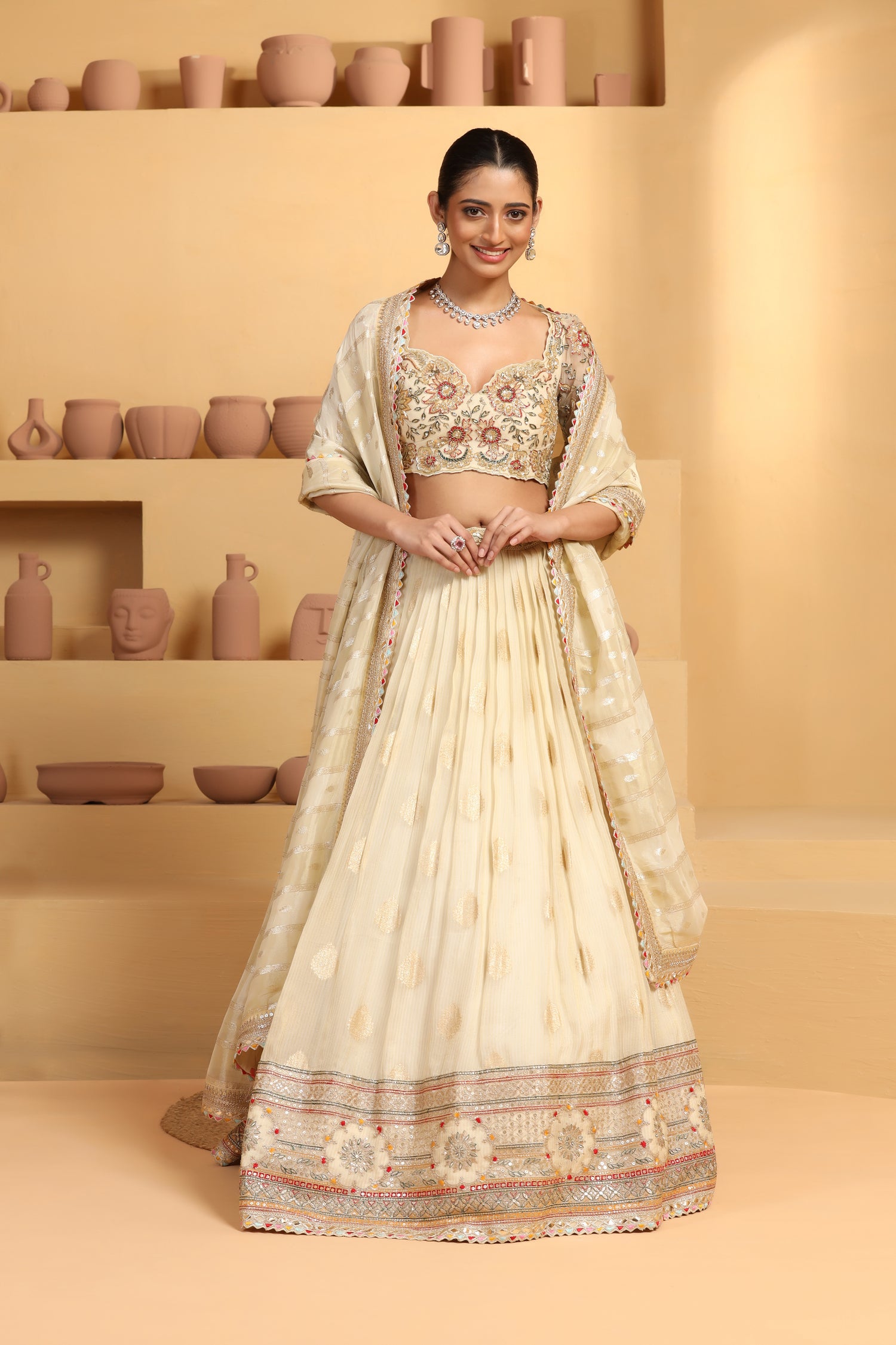 Nakshi, sequin cutdana resham mixed hand crafted choli plus Tissue jacquard lehenga with border