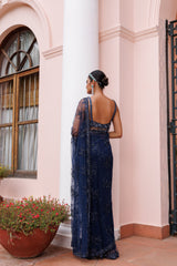 Exquisite royal blue saree with sparkling floral details and intricate beadwork.