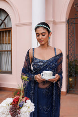 Exquisite royal blue saree with sparkling floral details and intricate beadwork.