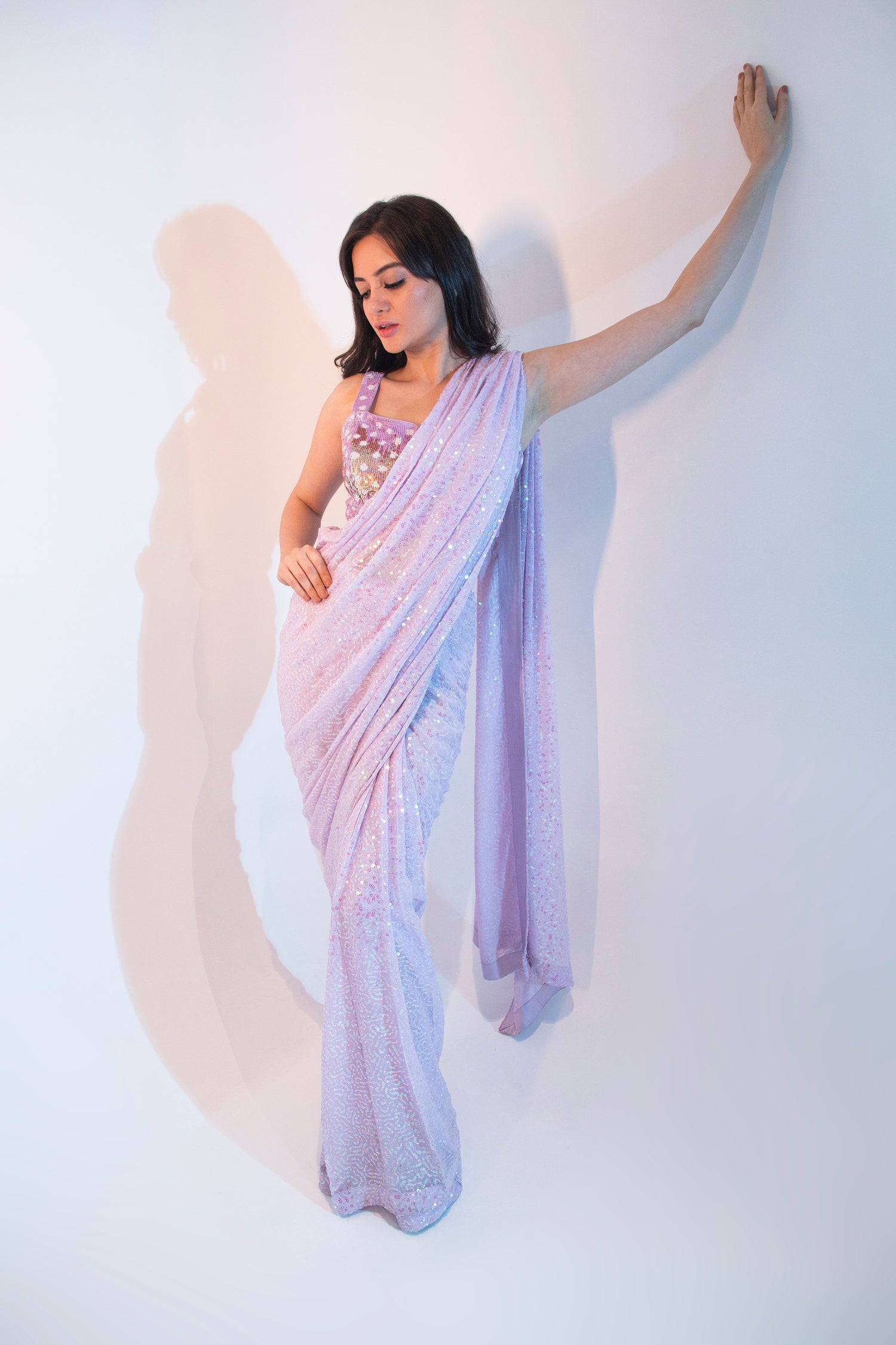 Lilac embroidered saree with multi tone sequence work blouse.