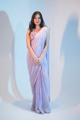 Lilac embroidered saree with multi tone sequence work blouse.