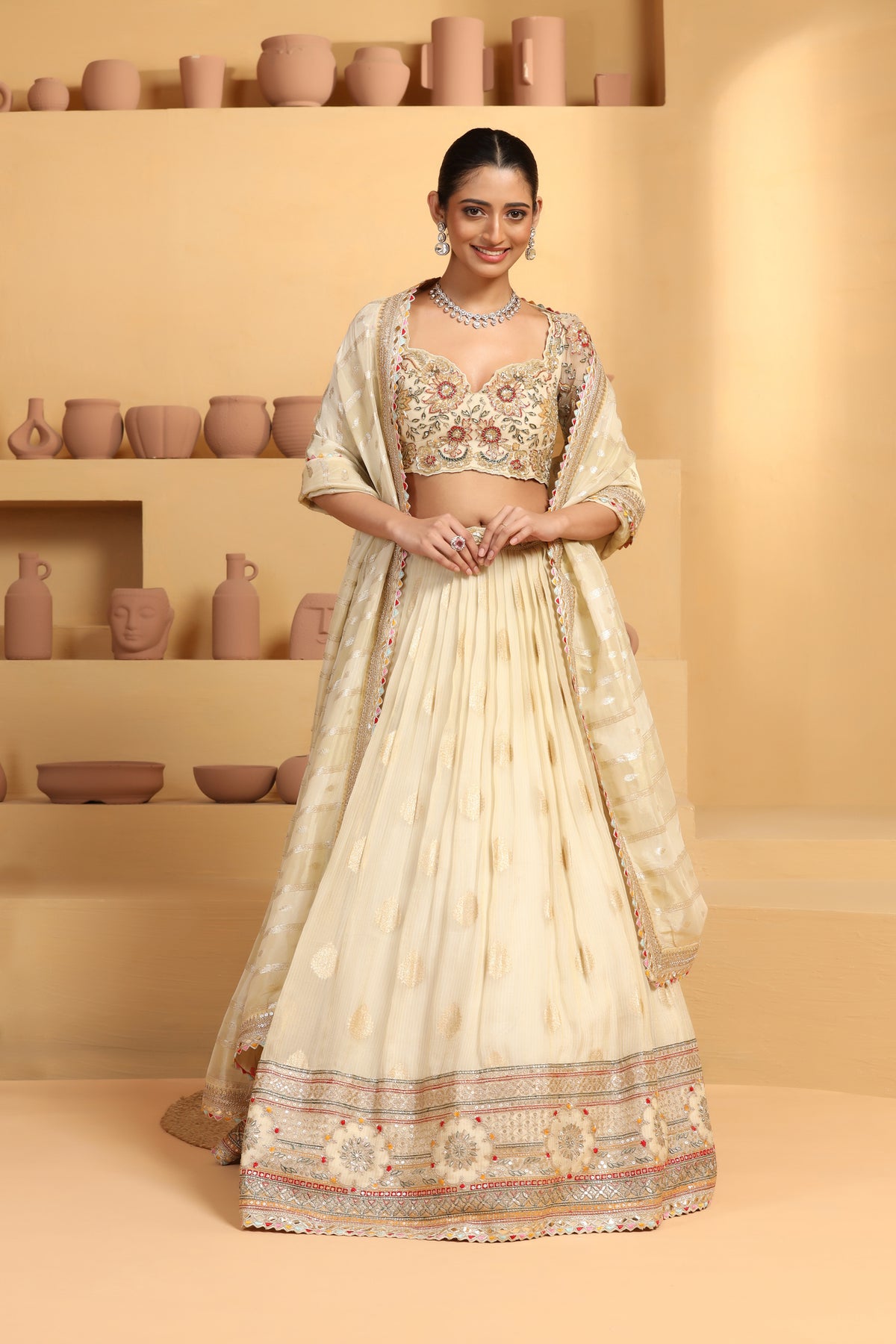 Nakshi, sequin cutdana resham mixed hand crafted choli plus Tissue jacquard lehenga with border.