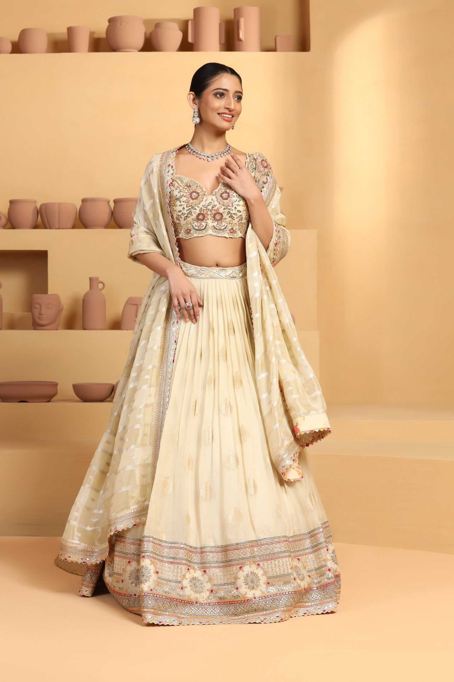 Nakshi, sequin cutdana resham mixed hand crafted choli plus Tissue jacquard lehenga with border.